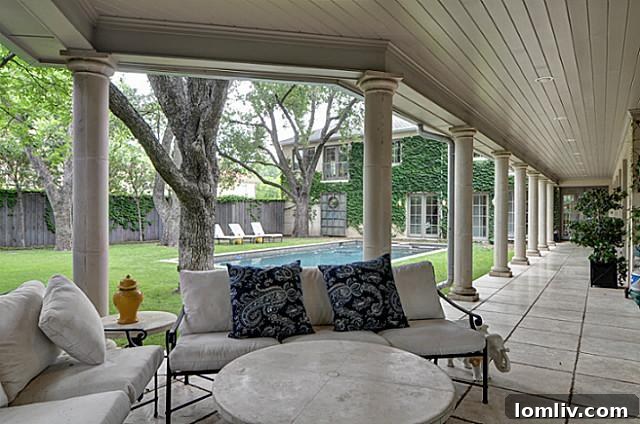 Charming covered porch overlooking the pool at 4465 Rheims Place