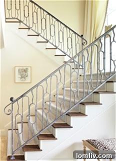 Elegant staircase in the foyer of Kimberly Schlegel Whitman's Highland Park home
