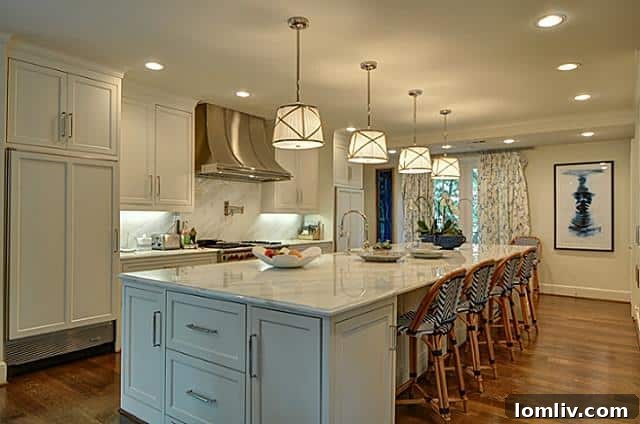 Modern gourmet kitchen with Carrera marble island at 4465 Rheims Place