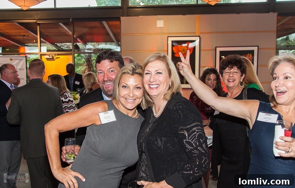 Great Western Home Loans' Jeff Lindigrin and Lydia Player, expert photobombers at D Magazine's Best Realtors event