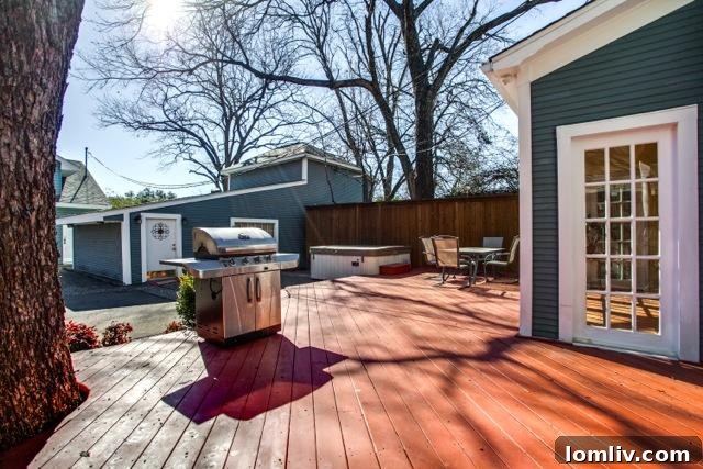 View from the deck into the lush backyard of 4826 Swiss Avenue, highlighting its private setting.