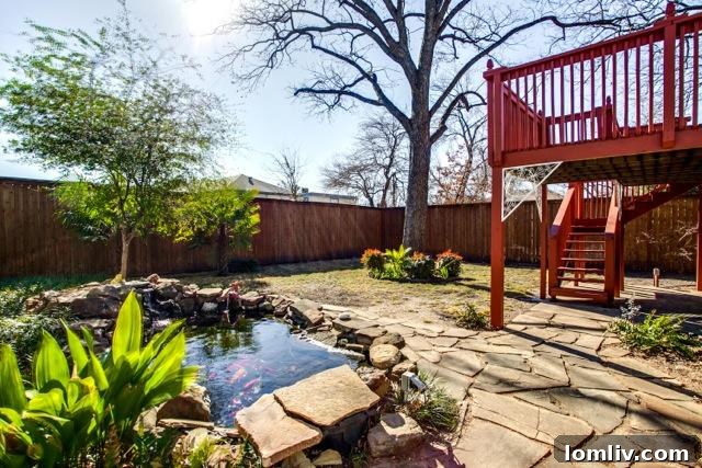 The tranquil koi pond in the backyard of 4826 Swiss Avenue, adding a touch of nature.
