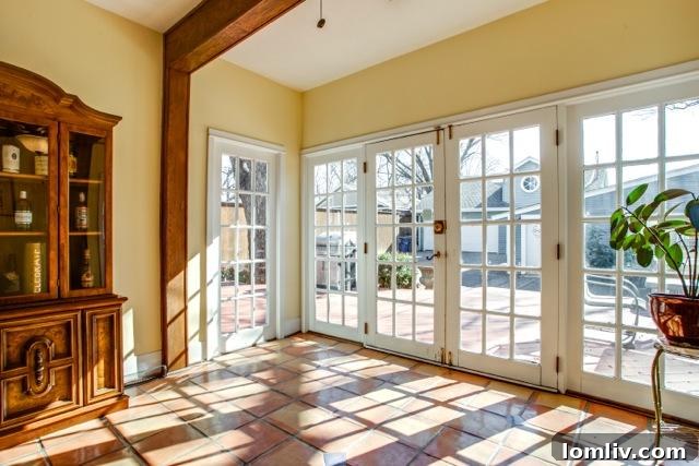 The bright breakfast area at 4826 Swiss Avenue, featuring elegant French doors.
