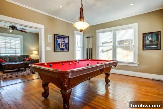 An inviting living and game room area within 4826 Swiss Avenue, offering versatile space.