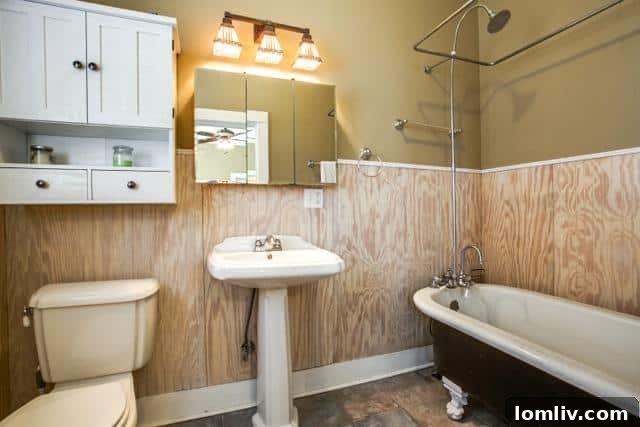 A luxurious master bathroom at 4826 Swiss Avenue, featuring modern fixtures and elegant finishes.