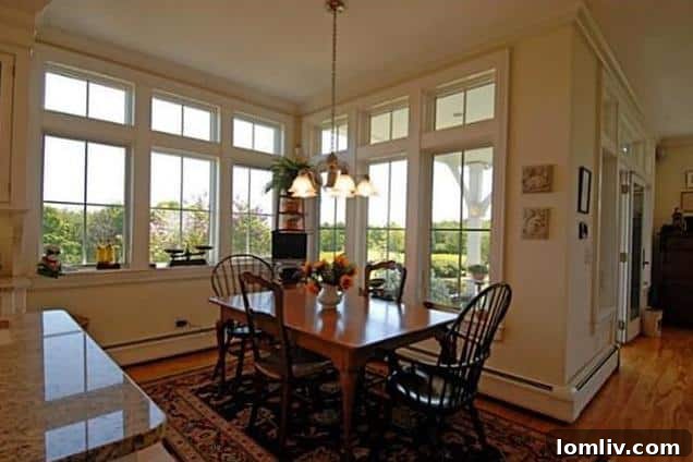 Bright breakfast nook with garden views in a Maine home