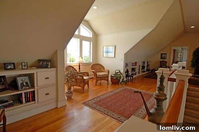 Grand landing area with stairway in a Rockport, Maine luxury home
