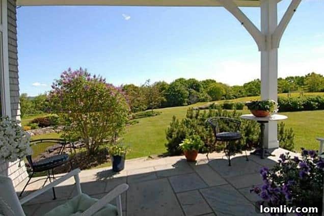 Elegant porch of a Rockport, Maine luxury home with ocean backdrop