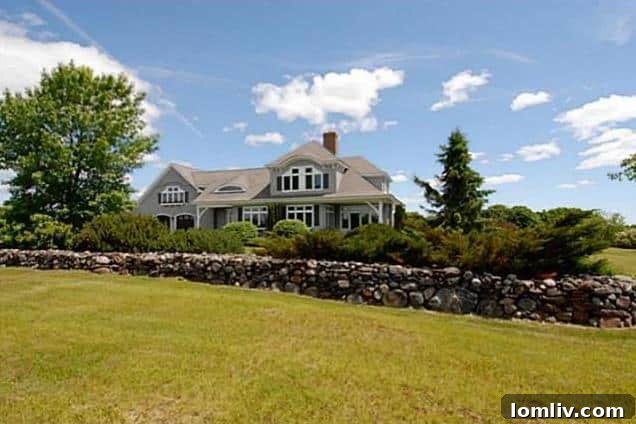 Long shot of luxury Rockport, Maine home nestled in landscape