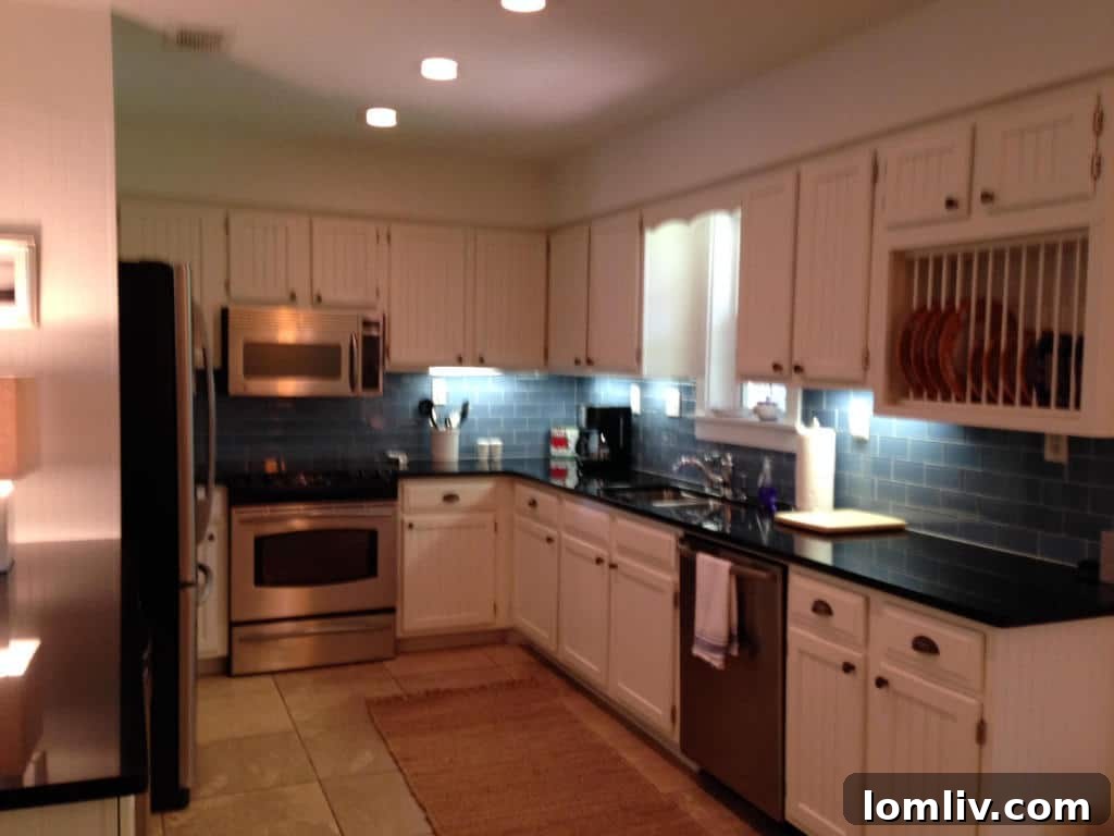 Modern bathroom with new tiling and fixtures in the remodeled Florida cottage
