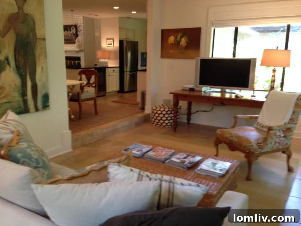 Inviting screened porch overlooking the tranquil canal, perfect for relaxation