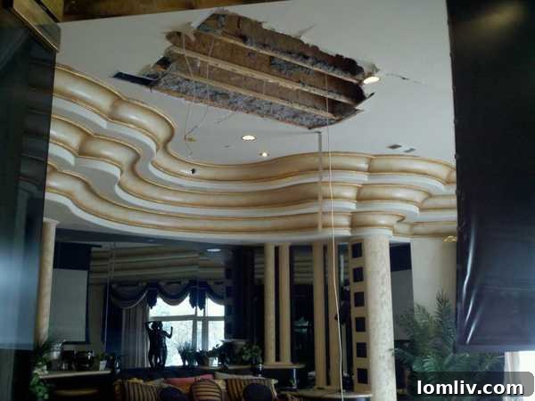 Closer view of the extensive water damage affecting the luxurious interior