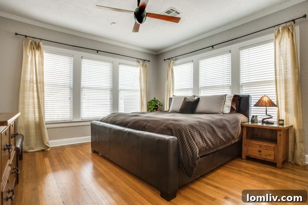 Side view of the Tudor home, highlighting its charming exterior details and well-kept grounds.