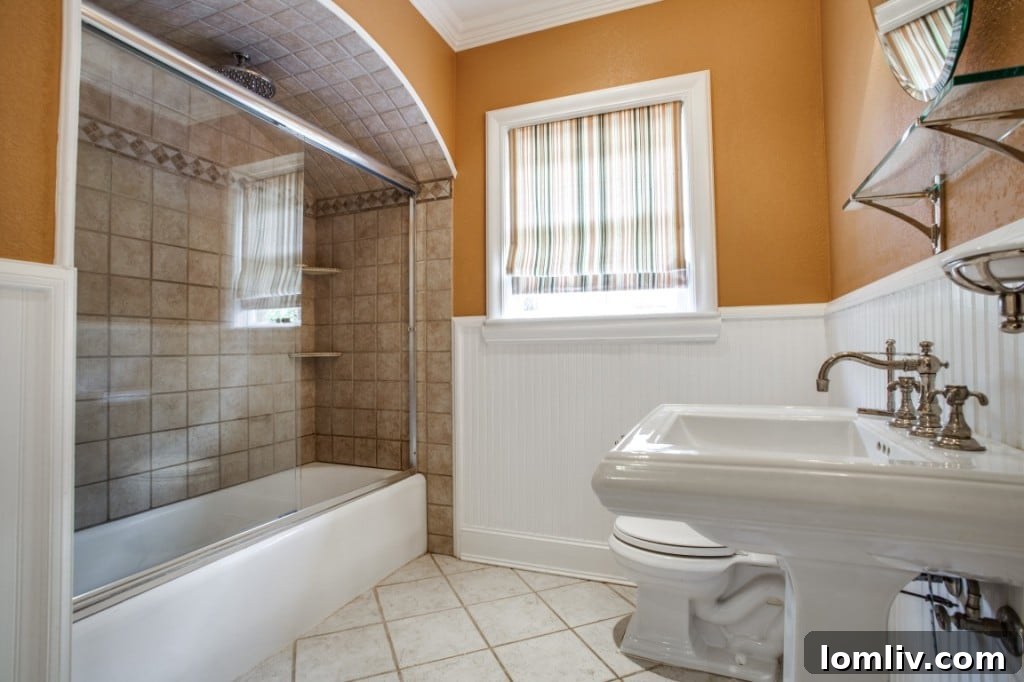 Interior view of the kitchen area, showing functional space and access to other rooms.
