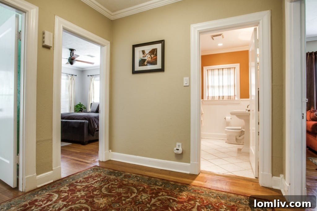 Another perspective of the interior, showcasing the seamless flow between living spaces and original details.