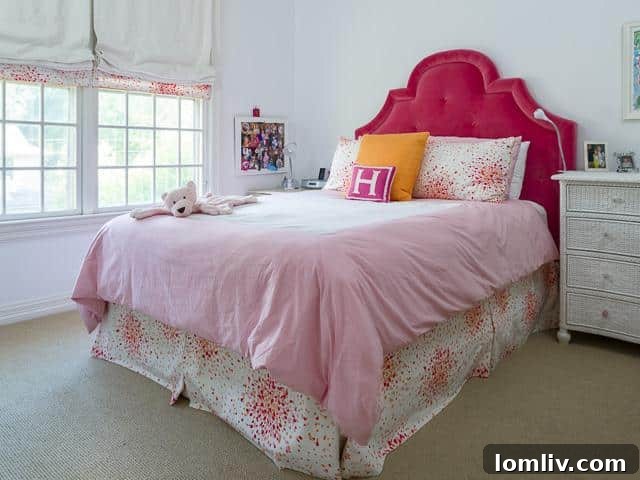 Cozy bedroom with ample natural light and plush carpeting