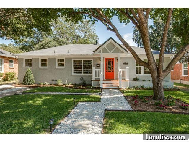 The charming orange front door and stone pathway of 9836 Gooding Drive, a transitional home in Dallas.