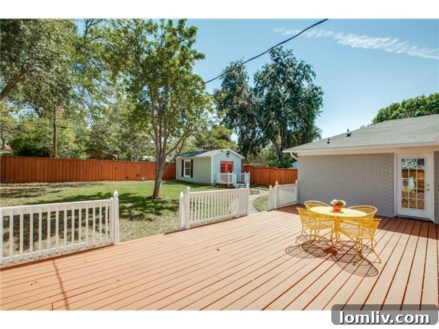 Another perspective of the large outdoor deck, showcasing ample space for seating and gatherings.