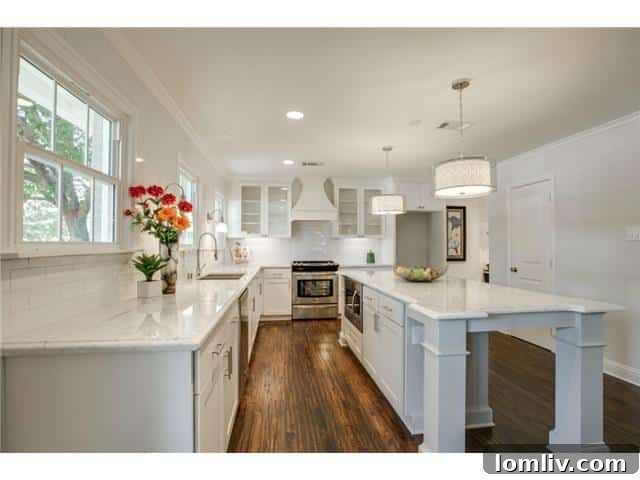 A stunning transitional kitchen featuring marble countertops, subway tile backsplash, and stainless steel appliances.