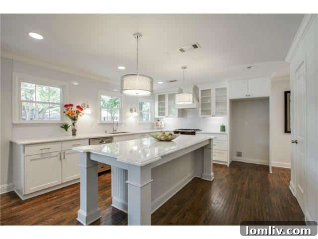 Close-up view of the modern kitchen island with pendant lighting and ample counter space.