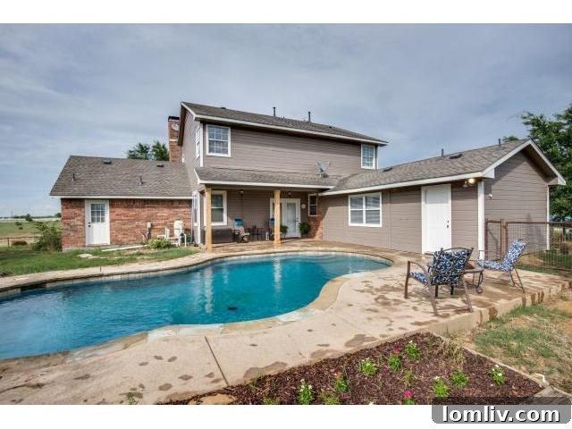 Refreshing in-ground gunite pool surrounded by a spacious patio area