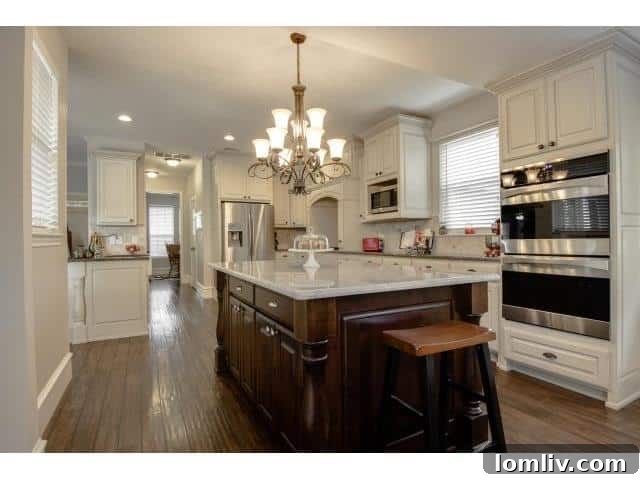 Another perspective of the modern kitchen with high-end appliances and custom cabinetry
