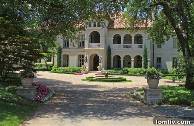 Majestic front entry with lush landscaping at 9639 Hollow Way Road, Preston Hollow