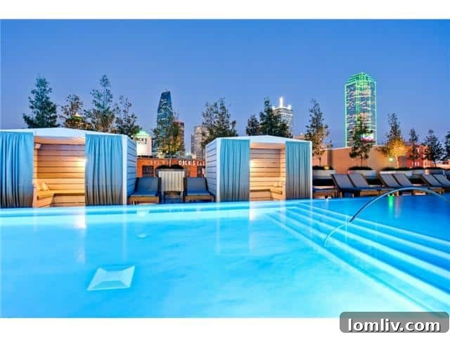 The House pool deck with stunning city backdrop in Dallas