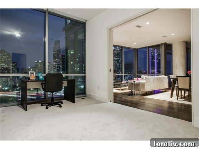 Home office setup with city backdrop in a luxury Dallas condo