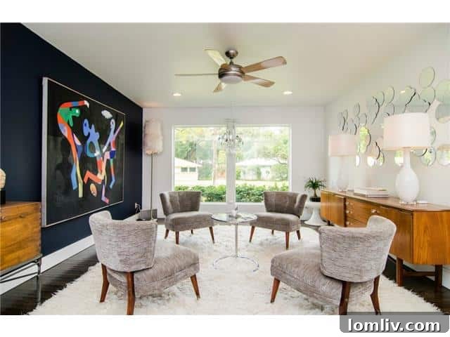 Formal Living Area with Navy Accent Walls in Timber Trail Home