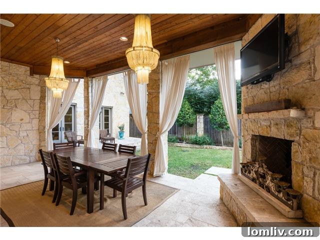 Expansive outdoor patio with fireplace and grill
