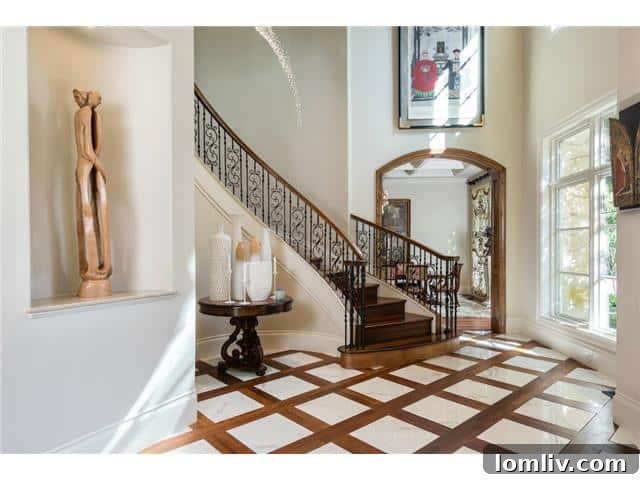 Grand foyer of 3620 Maplewood with elegant staircase