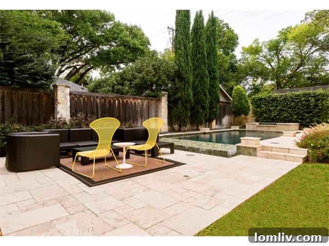 Sparkling swimming pool with ample surrounding patio space