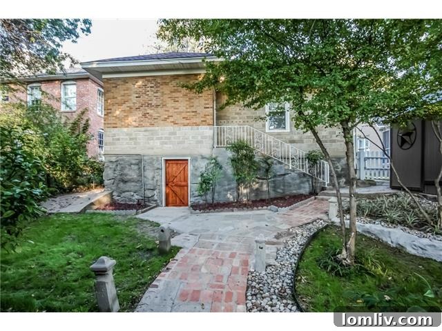 Beautifully manicured backyard with varied plant life and stone pathways