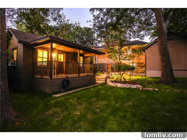 Guesthouse kitchenette with hidden appliances and custom cabinets