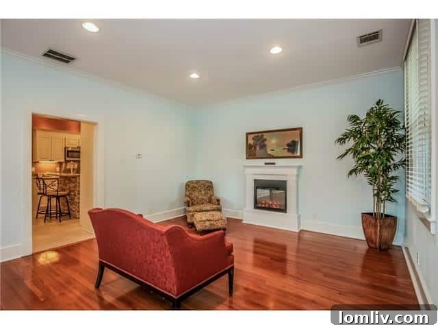 Living room with powder blue walls and custom electric fireplace at 1511 Seevers