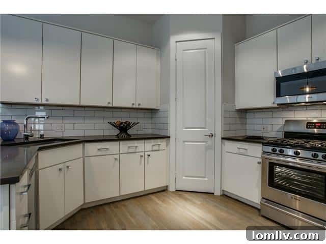 Sleek and Modern Kitchen with Island at 3807 Van Ness