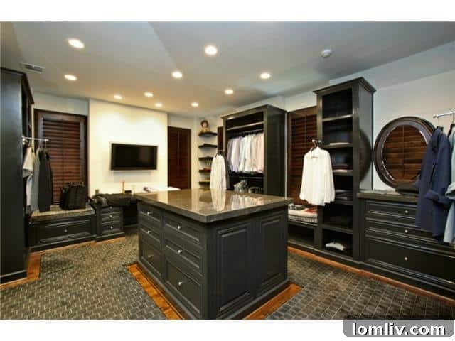 Troy Aikman's Highland Park Estate Now Commands $5.95 Million 12 One of the expansive 'his and her' custom walk-in closets, offering extensive storage and organization.