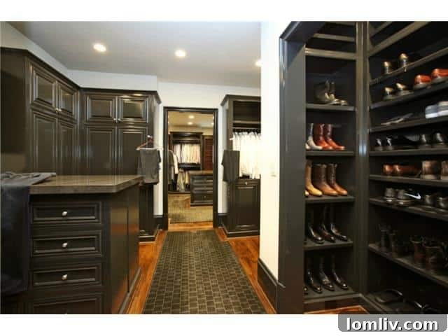 Troy Aikman's Highland Park Estate Now Commands $5.95 Million 13 Another view of the luxurious master closet, showcasing its bespoke design and ample space.