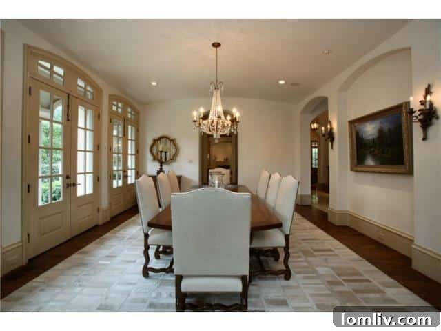 Troy Aikman's Highland Park Estate Now Commands $5.95 Million 7 Formal dining room with elegant chandelier, ready for lavish dinner parties.
