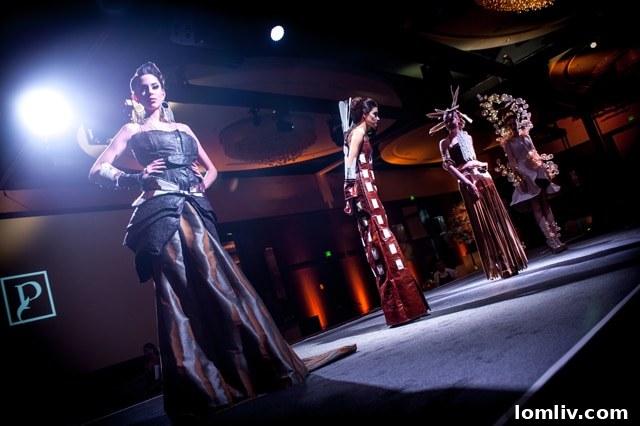Models elegantly display the Renaissance Collection on the runway during the grand reopening event.