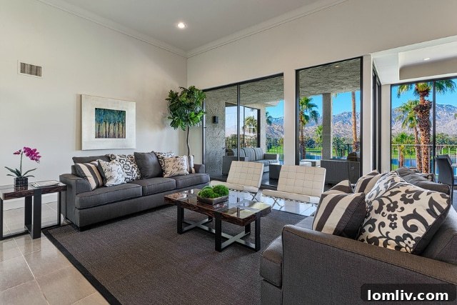 Living room with matching sofa and armchairs, a style that is fading out