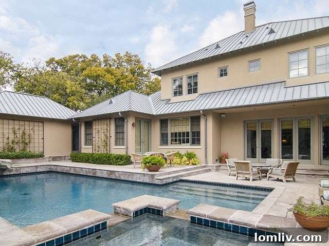 Rear yard view of 4222 Manning Lane, featuring pool and lush landscaping