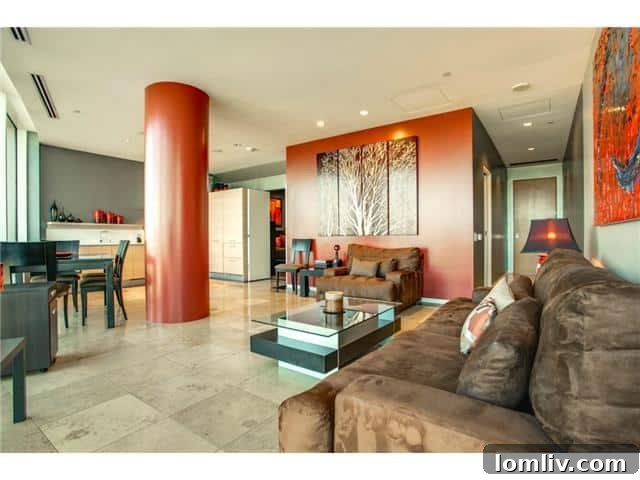 The W Residences Unit 2001 features an open concept living area with contemporary furnishings and abundant natural light.