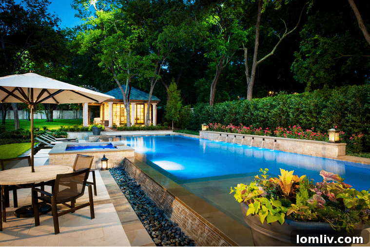 Modern infinity edge pool with fire pit by Pool Environments