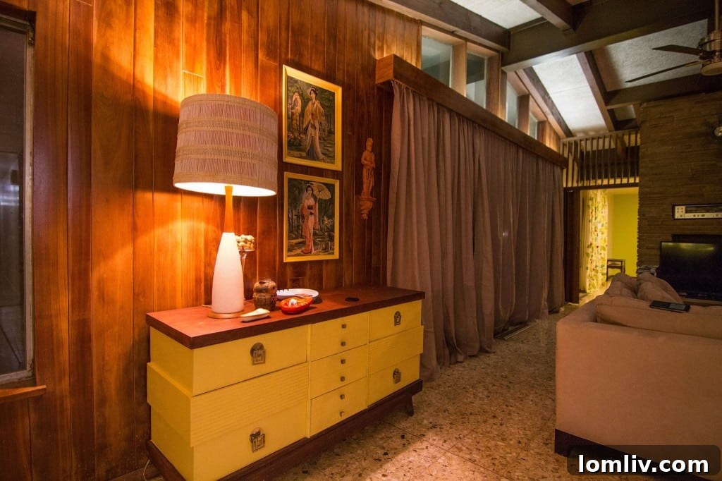 Detail of the elegant tongue-in-groove walnut plank walls in a main living area