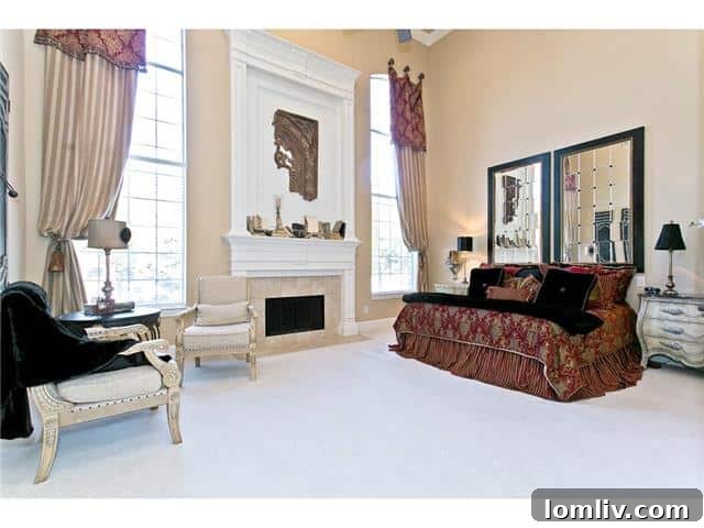 Spacious Master Bedroom with fireplace and tall ceilings at 2605 Eldorado Parkway