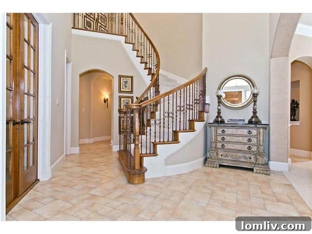 Grand Foyer with high ceilings and elegant staircase at 2605 Eldorado Parkway