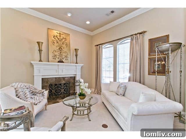 Elegant Formal Living Room with a cozy fireplace and abundant natural light at 2605 Eldorado Parkway