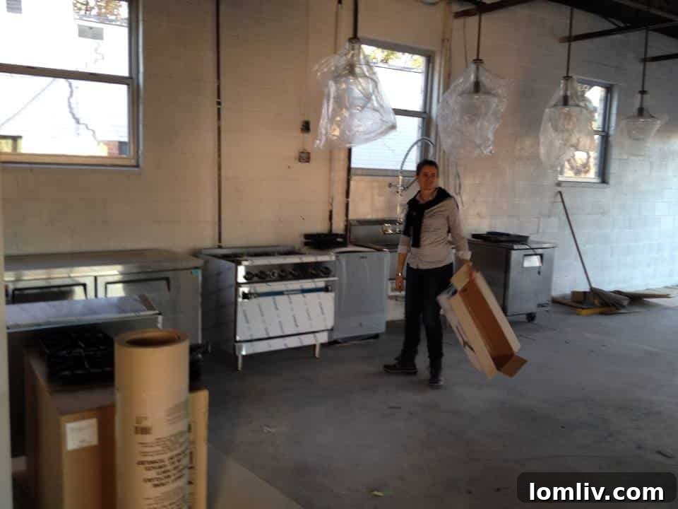 Val Haskell standing in the kitchen area of The Box during renovation